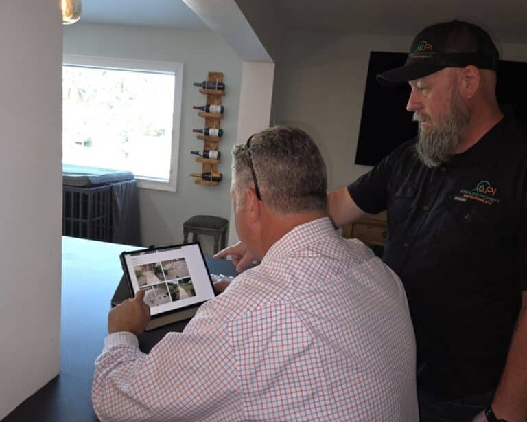 Steve from Absolute Property Inspections going over home inspection report with client